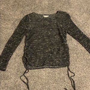 Dark grey sweater with side cutouts